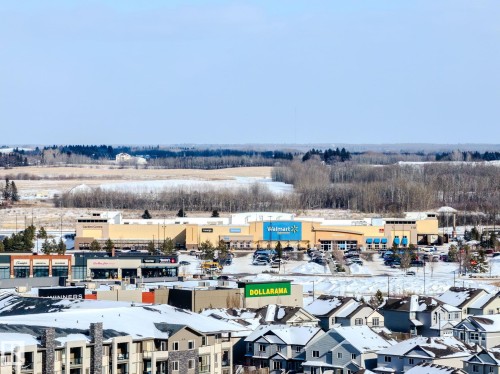 View of the surrounding community featuring residential properties, commercial establishments, and distant undeveloped land - 1121 59A Street, Edmonton, AB - Outdoor With View