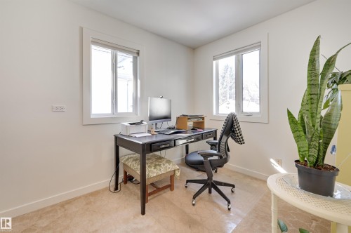 This room features light-colored walls and carpet flooring - 11116 52 Street Nw, Edmonton, AB - Indoor Photo Showing Office