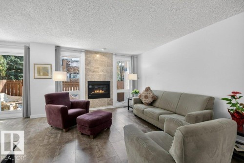 91 Hearthstone, Edmonton, AB - Indoor Photo Showing Living Room With Fireplace