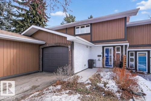 The property features cedar and stucco exterior with a single attached garage - 91 Hearthstone, Edmonton, AB - Outdoor