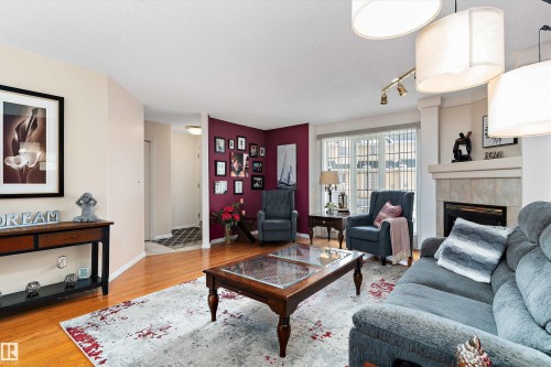 26 2419 133 Avenue, Edmonton, AB - Indoor Photo Showing Living Room With Fireplace