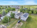Two-story duplex featuring light gray siding and dark shingle roofing - 5035 51 Avenue, Lamont, AB  - Outdoor With View 