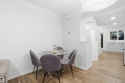 Dining space with light wood-style flooring - 