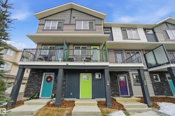 View of front facade with a balcony and stone siding - 