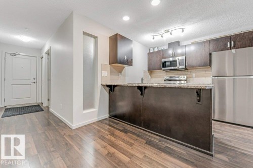221 5515 7 Avenue Sw, Edmonton, AB - Indoor Photo Showing Kitchen With Upgraded Kitchen