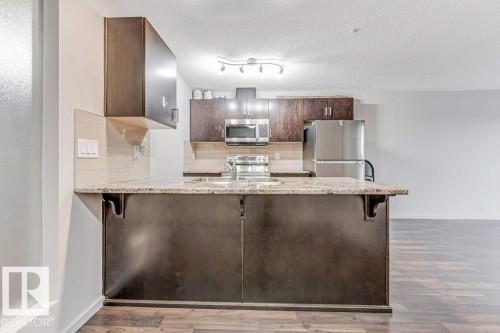 221 5515 7 Avenue Sw, Edmonton, AB - Indoor Photo Showing Kitchen With Upgraded Kitchen