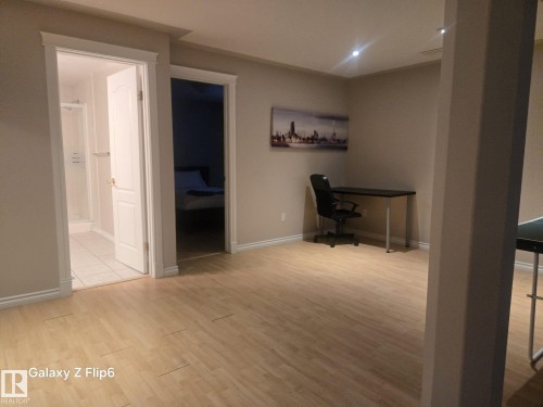 This interior space features light-toned flooring and neutral wall colors - Edmonton, AB - Indoor Photo Showing Other Room
