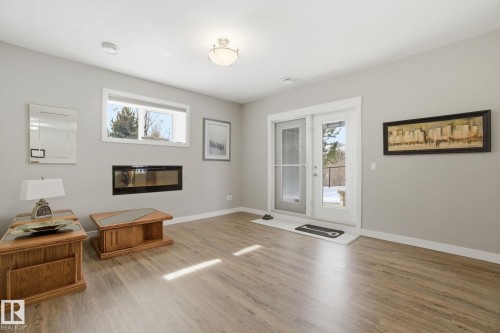 16 3090 Cameron Heights Way, Edmonton, AB - Indoor Photo Showing Living Room With Fireplace