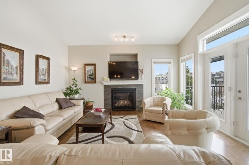 16 3090 Cameron Heights Way, Edmonton, AB - Indoor Photo Showing Living Room With Fireplace