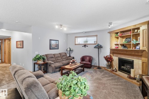 5 Richelieu Place, Beaumont, AB - Indoor Photo Showing Living Room With Fireplace