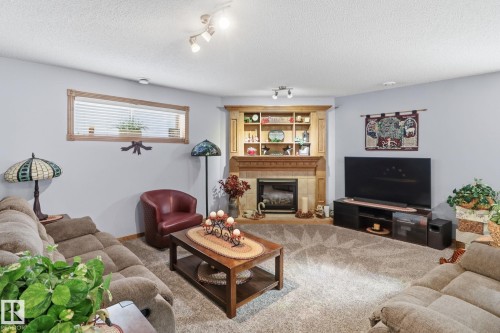 5 Richelieu Place, Beaumont, AB - Indoor Photo Showing Living Room With Fireplace