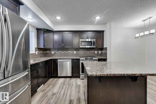 59 Harvest Ridge Drive, Spruce Grove, AB - Indoor Photo Showing Kitchen With Stainless Steel Kitchen With Upgraded Kitchen