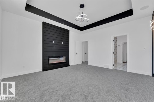 211 Basin Court, Leduc, AB - Indoor With Fireplace