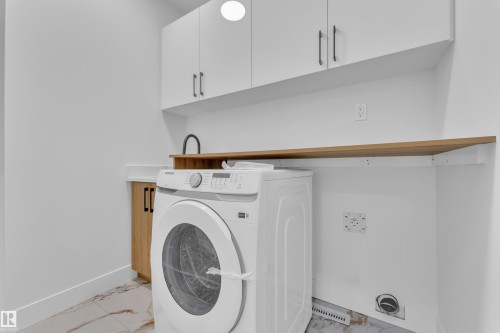 211 Basin Court, Leduc, AB - Indoor Photo Showing Laundry Room