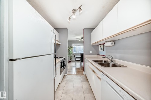 239 10636 120 Street, Edmonton, AB - Indoor Photo Showing Kitchen With Double Sink