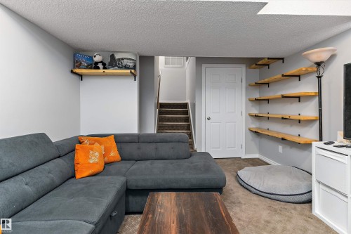 9 4403 Riverbend Road, Edmonton, AB - Indoor Photo Showing Living Room