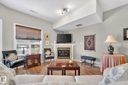 411 1320 Rutherford Road, Edmonton, AB - Indoor Photo Showing Living Room With Fireplace