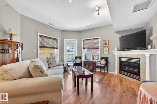 411 1320 Rutherford Road, Edmonton, AB - Indoor Photo Showing Living Room With Fireplace