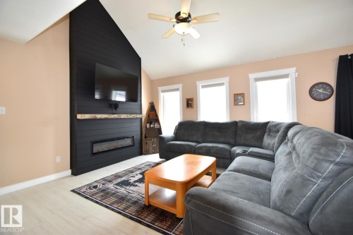 4604 4A Street, Boyle, AB - Indoor Photo Showing Living Room With Fireplace