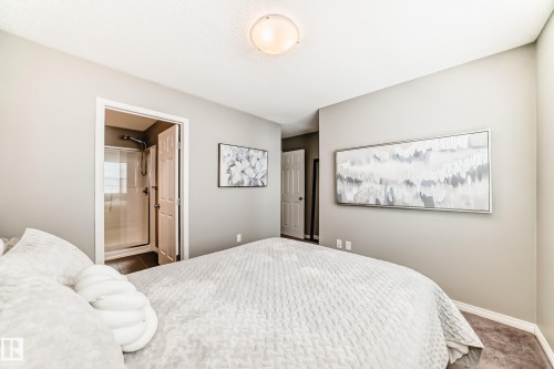 Room featuring light-colored walls and a neutral-toned carpet - 86 4029 Orchards Drive, Edmonton, AB - Indoor Photo Showing Bedroom