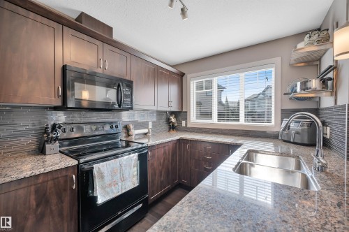 1768 Cunningham Way, Edmonton, AB - Indoor Photo Showing Kitchen With Double Sink