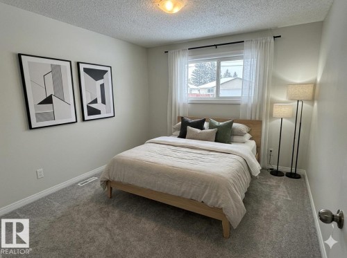 Bedroom featuring light grey carpet and a window - 13323 68 Street, Edmonton, AB - Indoor Photo Showing Bedroom