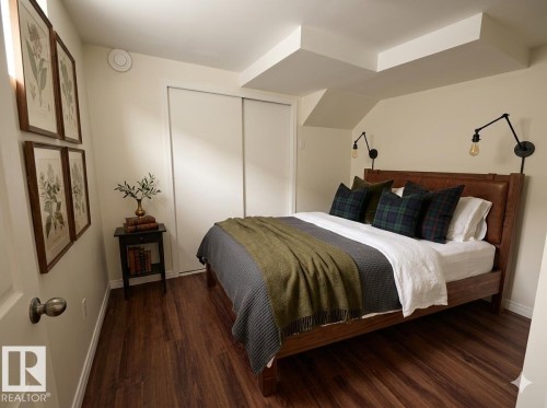 This room features rich wood flooring - 13323 68 Street, Edmonton, AB - Indoor Photo Showing Bedroom