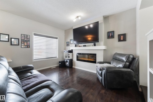 8333 Ellis Crescent, Edmonton, AB - Indoor Photo Showing Living Room With Fireplace