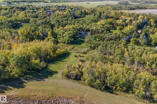 Aerial view showcasing the properties privacy and mature landscaping - 602 Pheasant Close, Rural Camrose County, AB - Outdoor With View