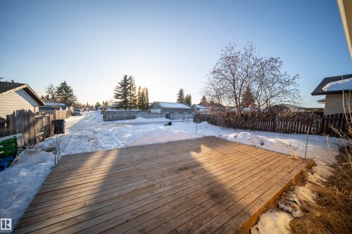 Snow covered deck with a fenced backyard and a residential view - 2311 146 Avenue, Edmonton, AB - Outdoor