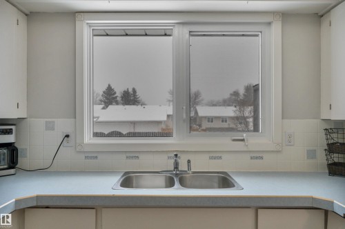 31 Camelot Crescent, Leduc, AB - Indoor Photo Showing Kitchen With Double Sink
