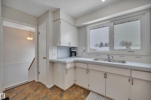 31 Camelot Crescent, Leduc, AB - Indoor Photo Showing Kitchen With Double Sink