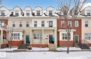 The property features a charming covered porch with columns, a private balcony, and a bay window - 11 4367 Veterans Way, Edmonton, AB  - Outdoor With Facade 