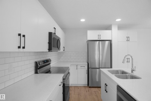 59 19904 31 Avenue, Edmonton, AB - Indoor Photo Showing Kitchen With Double Sink With Upgraded Kitchen