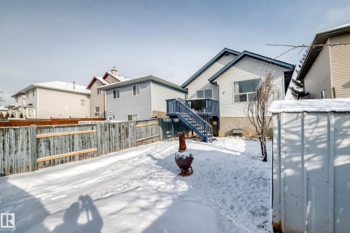 The property features a fenced yard, a rear deck with stairs, and a storage shed - 1911 36 Avenue, Edmonton, AB - Outdoor With Exterior