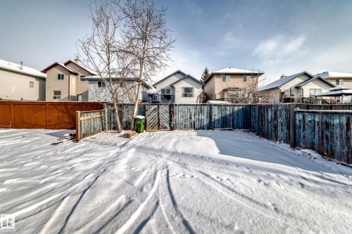 The property features a fenced yard with a gate, providing a private outdoor space - 1911 36 Avenue, Edmonton, AB - Outdoor