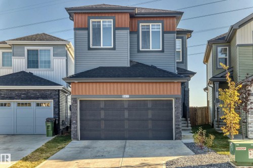 The property features a multi-toned exterior with horizontal siding and accent panels - 9411 Pear Crescent, Edmonton, AB - Outdoor With Facade