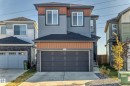 The property features a multi-toned exterior with horizontal siding and accent panels - 9411 Pear Crescent, Edmonton, AB  - Outdoor With Facade 