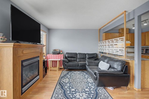 79 16823 84 Street, Edmonton, AB - Indoor Photo Showing Living Room With Fireplace