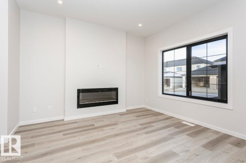 3 Clichy Close, St. Albert, AB - Indoor Photo Showing Living Room With Fireplace