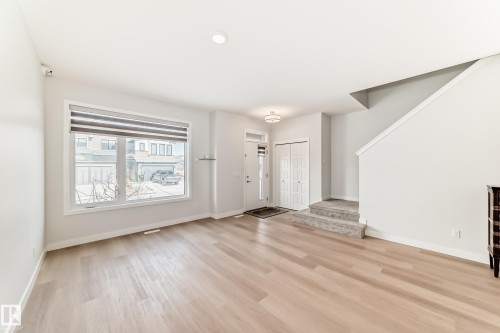 4005 Hawthorn Link Link, Edmonton, AB - Indoor Photo Showing Other Room With Fireplace