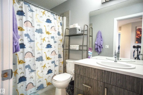 Bathroom featuring a vanity with a white countertop and a single basin sink - 20503 99 Avenue, Edmonton, AB - Indoor Photo Showing Bathroom