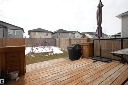 Expansive wooden deck with space for outdoor entertaining, overlooking a fenced yard - 20503 99 Avenue, Edmonton, AB - Outdoor With Deck Patio Veranda With Exterior