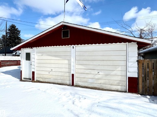 Detached garage with two garage doors and a side access door - 12219 48 Street, Edmonton, AB - Outdoor With Exterior