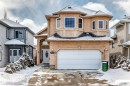 The property features a stucco exterior, an attached garage, and a welcoming front entrance with an oval glass insert in the door - 10631 181 Avenue, Edmonton, AB  - Outdoor With Facade 