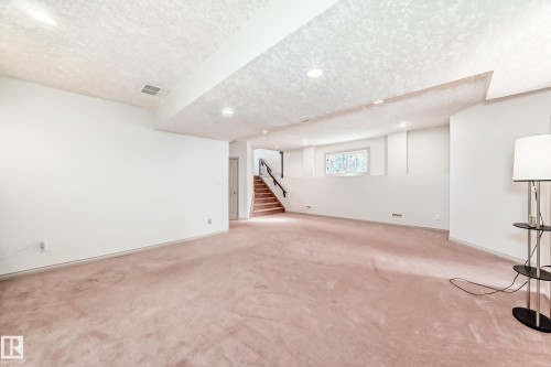 Expansive room featuring carpeted flooring, white walls, and recessed lighting - 10631 181 Avenue, Edmonton, AB - Indoor