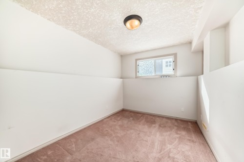 Room featuring a neutral colored carpet, white walls, and a window providing natural light - 10631 181 Avenue, Edmonton, AB - Indoor Photo Showing Other Room