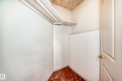 This closet features white walls, corner shelving, and a patterned ceiling - 10631 181 Avenue, Edmonton, AB - Indoor
