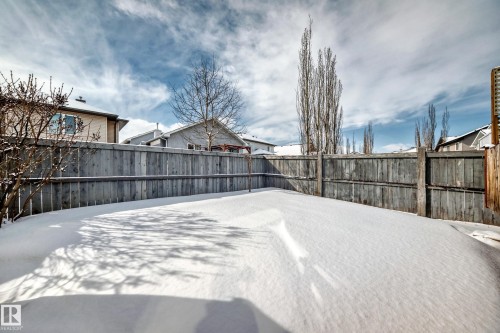 The property includes a fenced yard with natural wood fencing - 10631 181 Avenue, Edmonton, AB - Outdoor