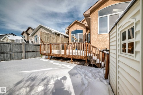 The property features a wooden deck with railing, a detached shed, and a fenced yard - 10631 181 Avenue, Edmonton, AB - Outdoor With Deck Patio Veranda